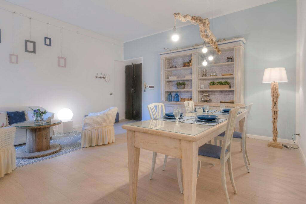 Bright dining room featuring rustic furniture and elegant decor elements.